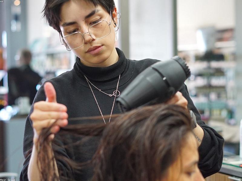 Stylist finishing a fresh look